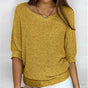 Women's textured knit sweater with wide round neck and three-quarter sleeves