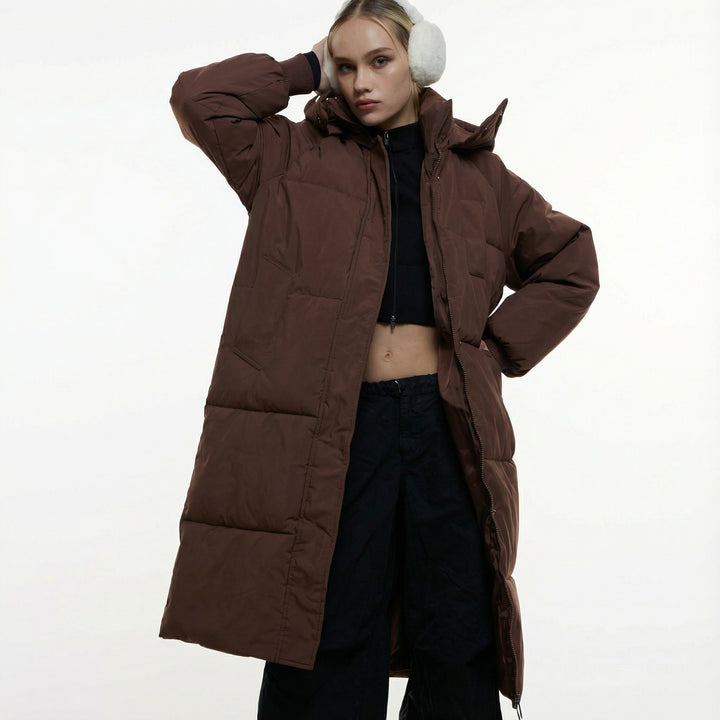 Women's long hooded puffer coat with quilted panels