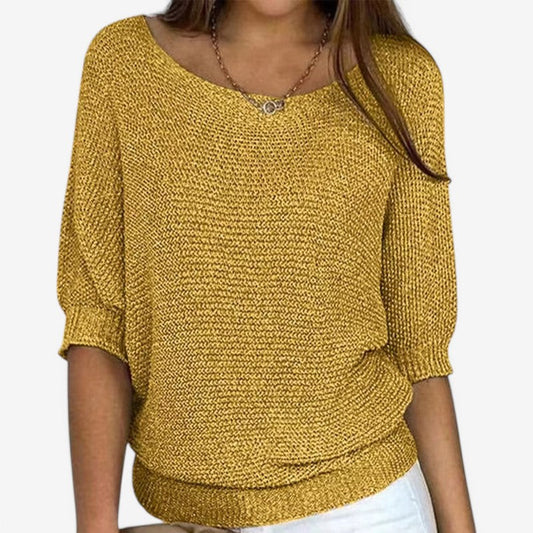 Women's textured knit sweater with round neck and three-quarter sleeves