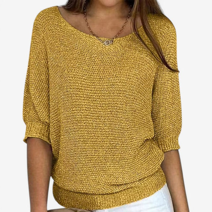 Women's textured knit sweater with round neck and three-quarter sleeves