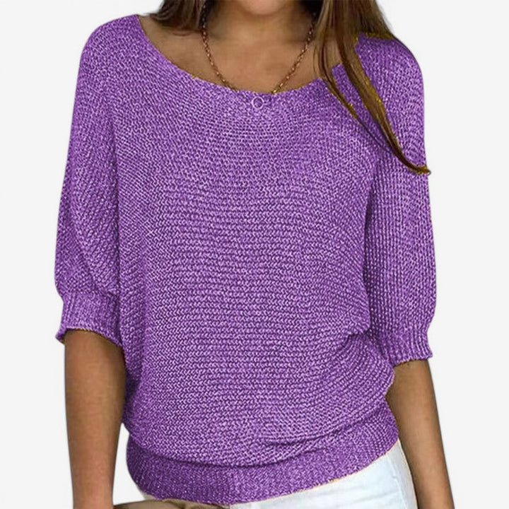 Women's textured knit sweater with round neck and three-quarter sleeves