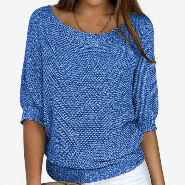 Women's textured knit sweater with round neck and three-quarter sleeves