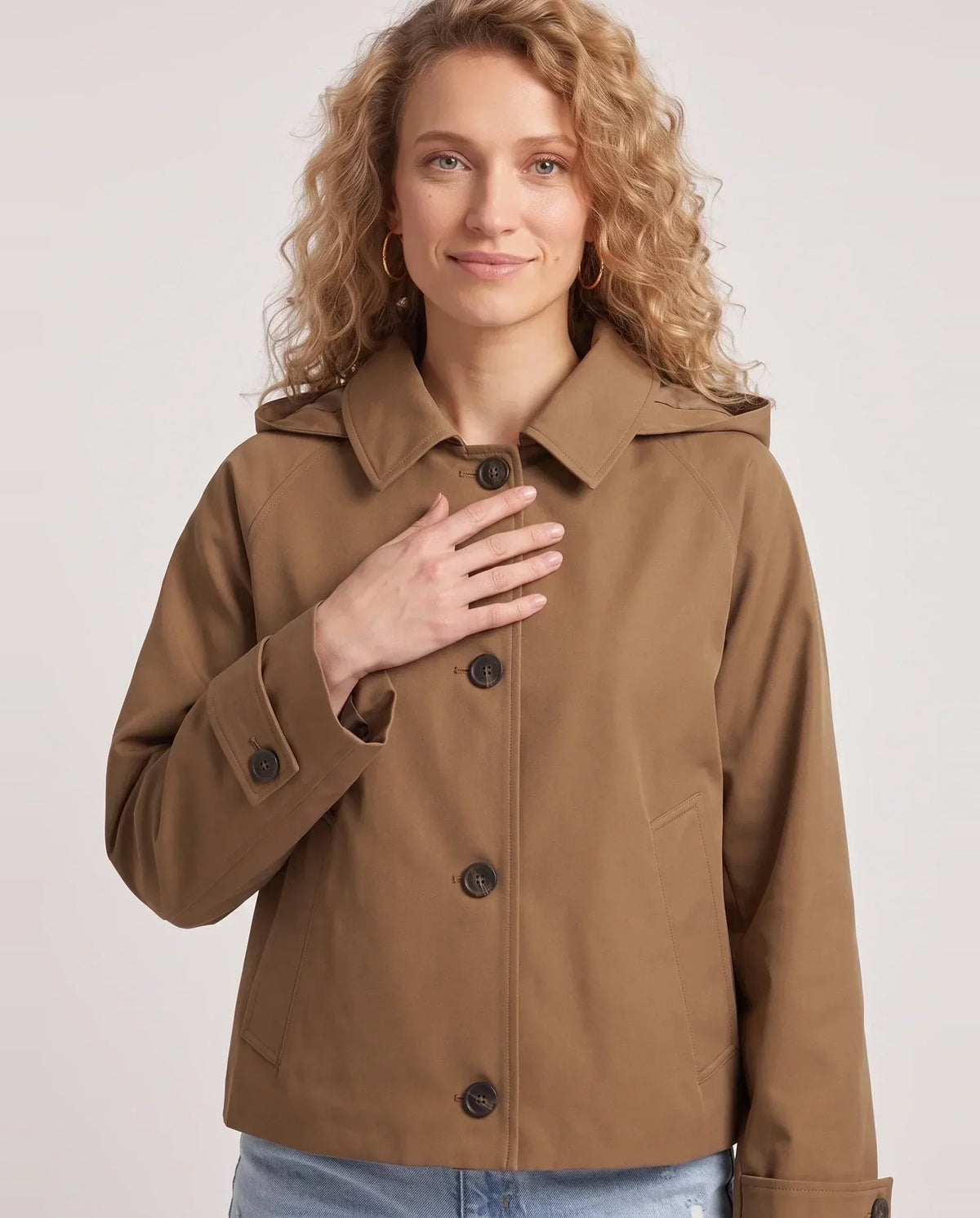 Women's short hooded trench jacket with button front and long sleeves