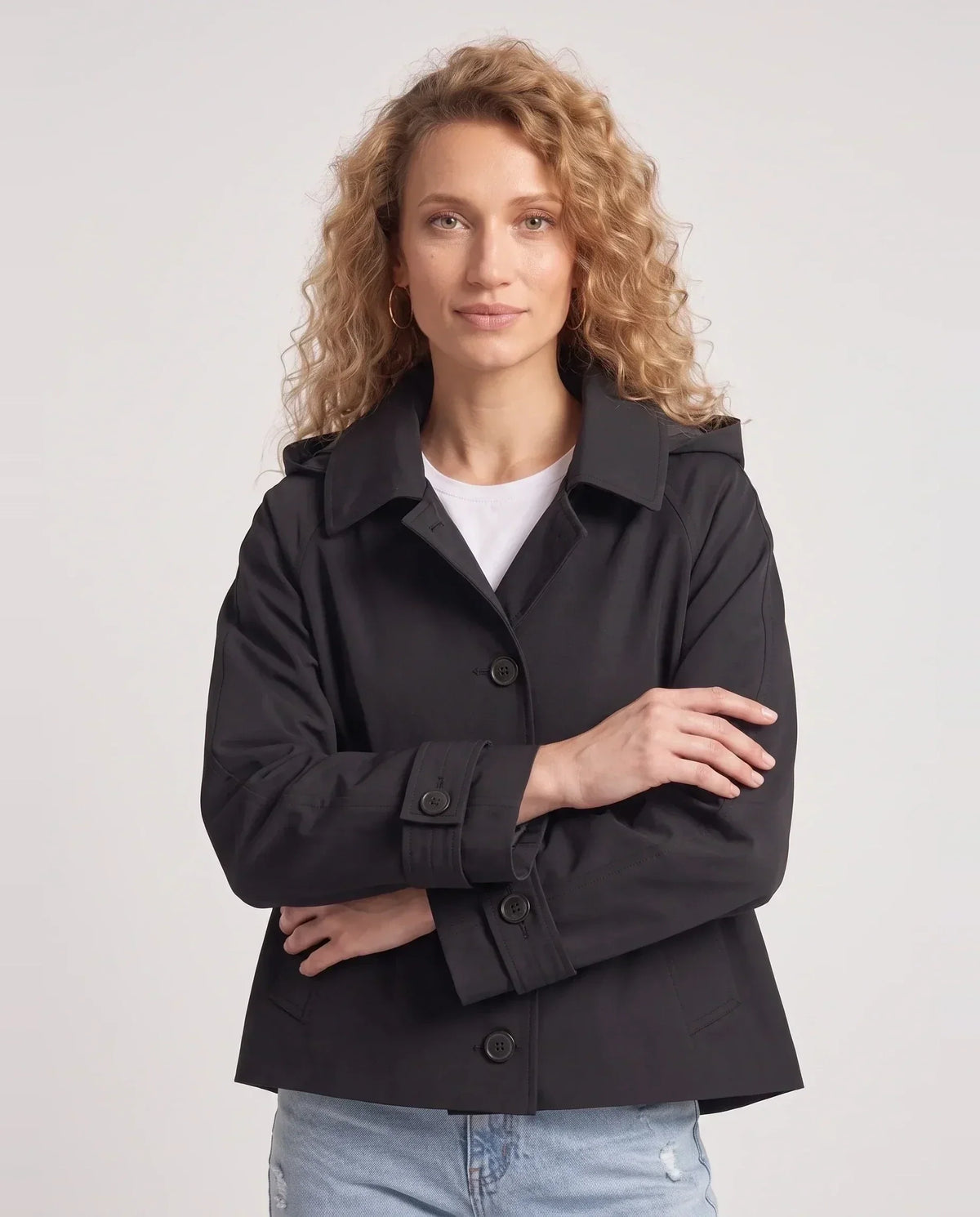 Women's short hooded trench jacket with button front and long sleeves