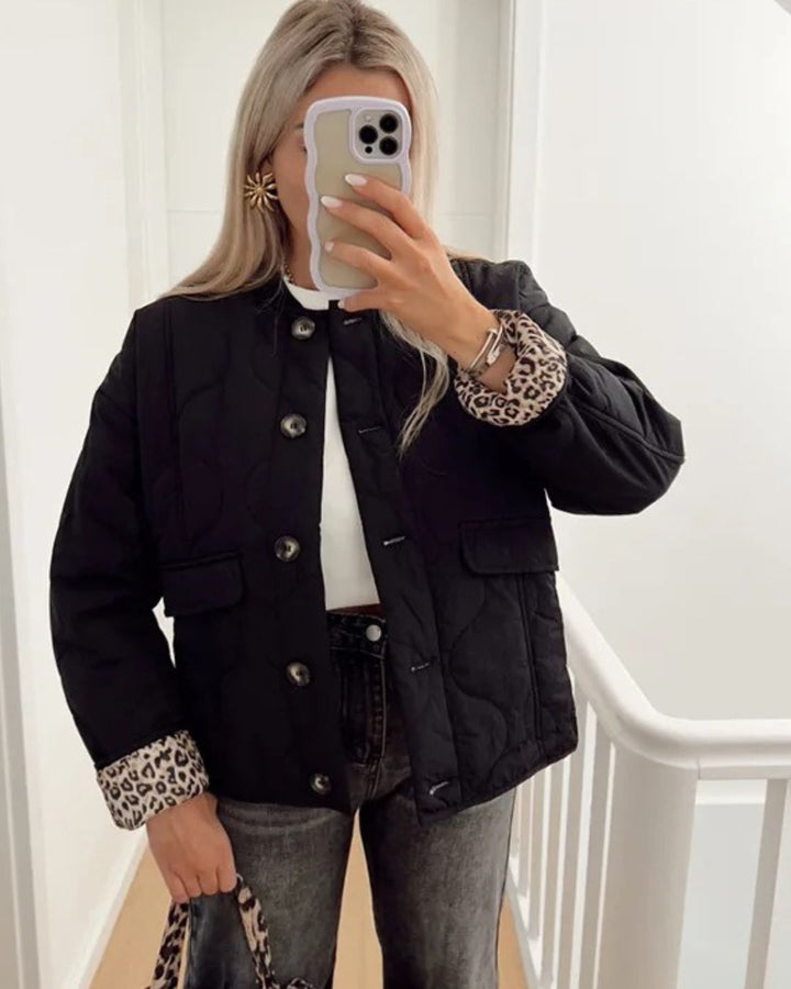 Women's quilted jacket with leopard-print cuffs, stand collar and patch pockets