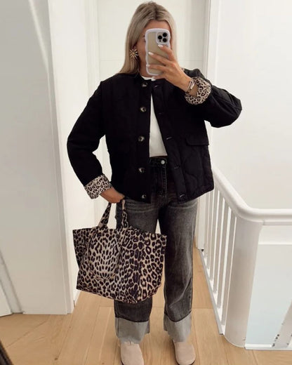 Women's quilted jacket with leopard-print cuffs, stand collar and patch pockets