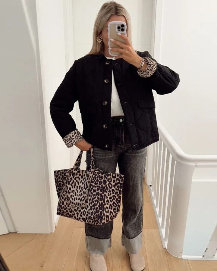 Women's quilted jacket with leopard-print cuffs, stand collar and patch pockets