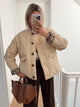 Women's quilted jacket with leopard-print cuffs, stand collar and patch pockets