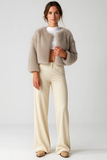 Women's short textured jacket shown in beige and black with long sleeves and an open front