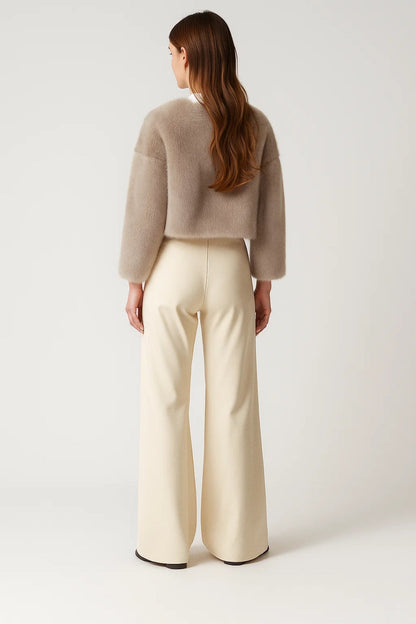 Women's short textured jacket shown in beige and black with long sleeves and an open front