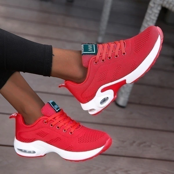 Women's low-top lace-up sneakers with textured panels and sculpted soles