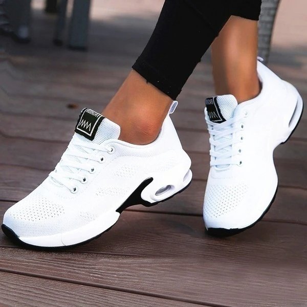 Women's low-top lace-up sneakers with textured panels and sculpted soles