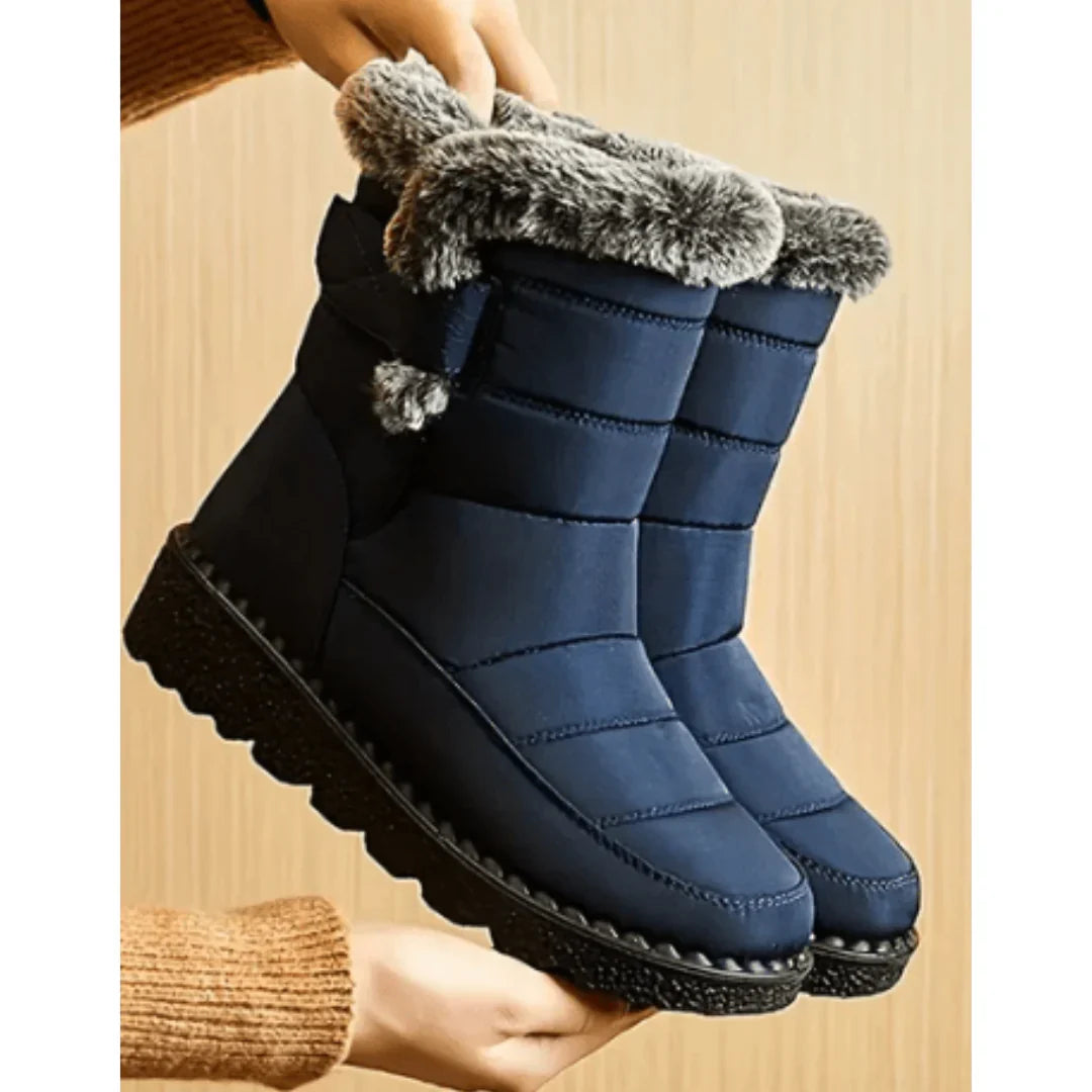 Quilted winter snow boots with faux fur trim and lugged soles