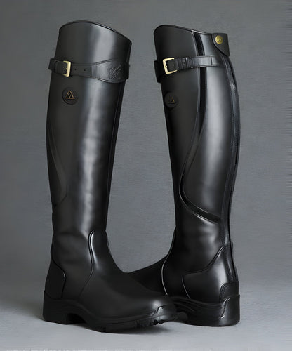 Tall women's riding boots with buckle straps, rounded toes and low heels