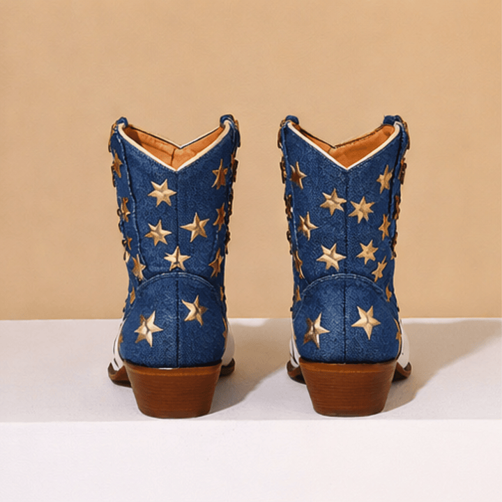White western boots with red striped shafts, blue panels and gold star details