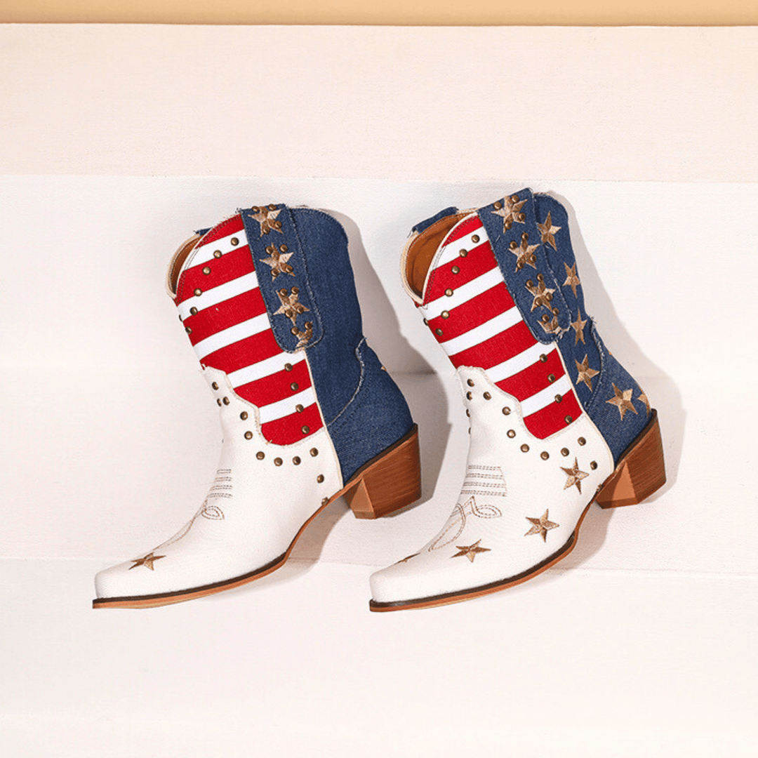 White western boots with red striped shafts, blue panels and gold star details