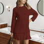 Women's cable knit sweater dress with crew neck and pleated mini hem