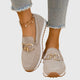 Women's textured slip-on loafers with decorative buckle detail and ridged soles