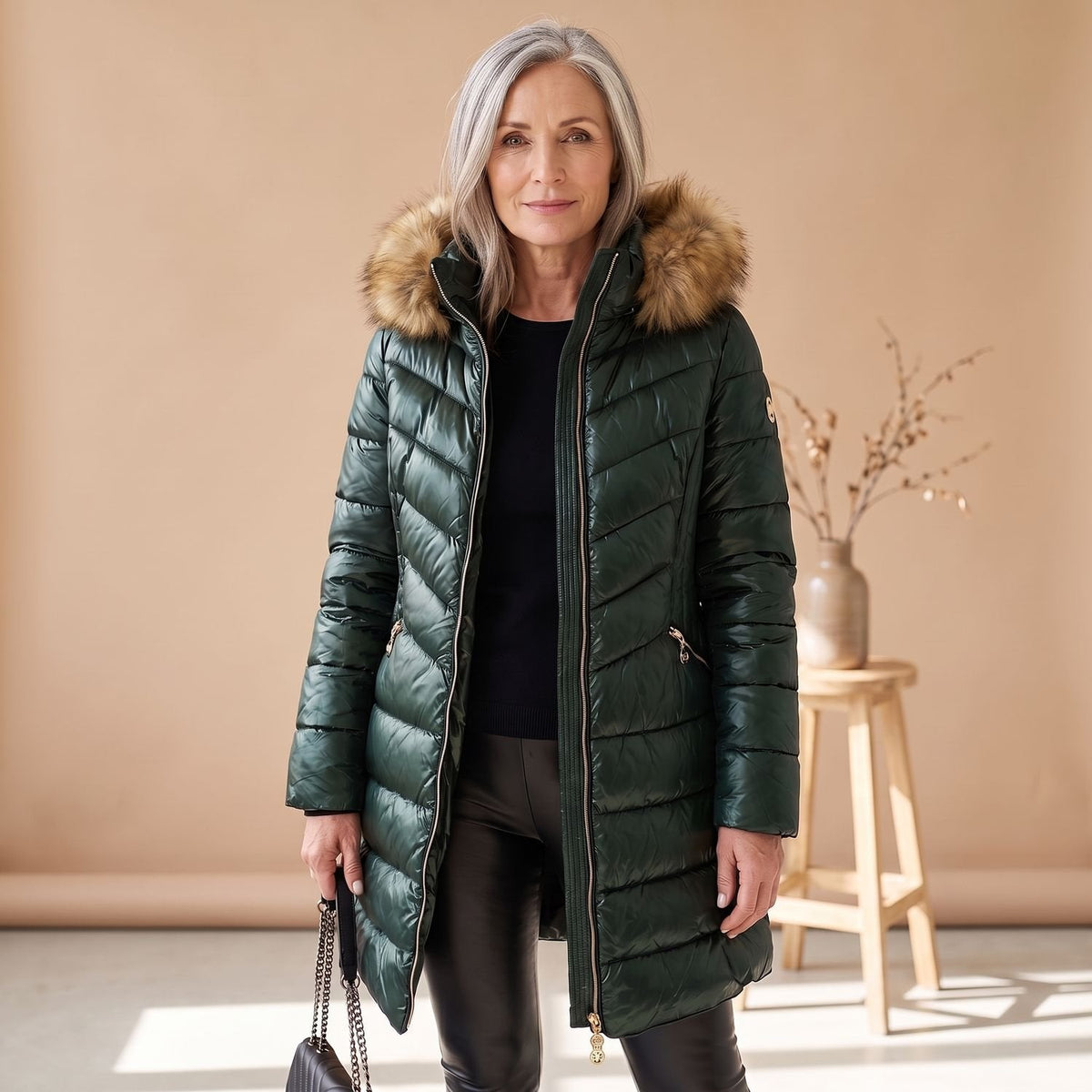 Women's longline quilted puffer coat with hood and faux fur trim
