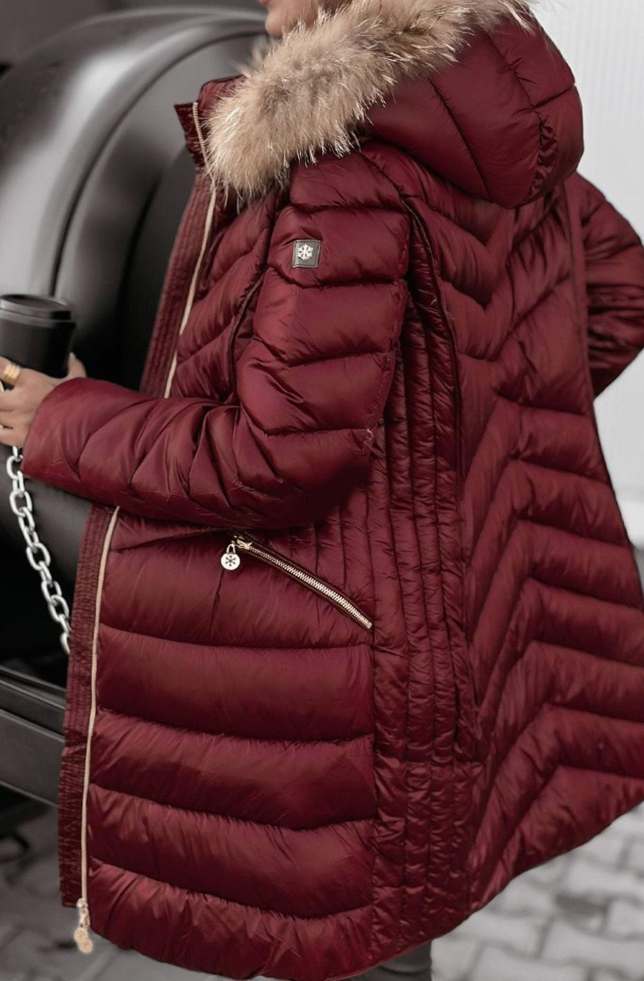 Women's longline quilted puffer coat with hood and faux fur trim
