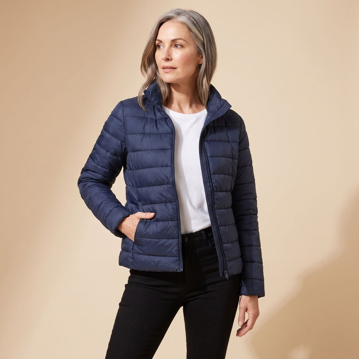 Women's quilted hooded longline puffer jacket with zip front and slanted pockets