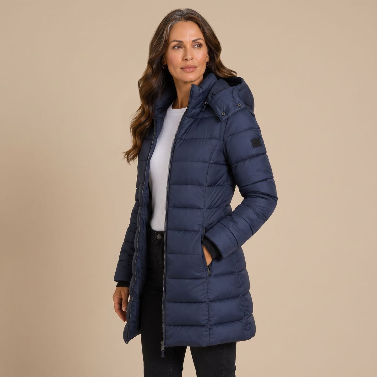 Women's quilted hooded longline puffer jacket with zip front and slanted pockets