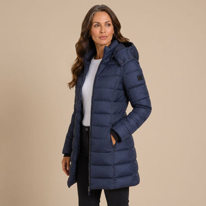 Women's quilted hooded longline puffer jacket with zip front and slanted pockets