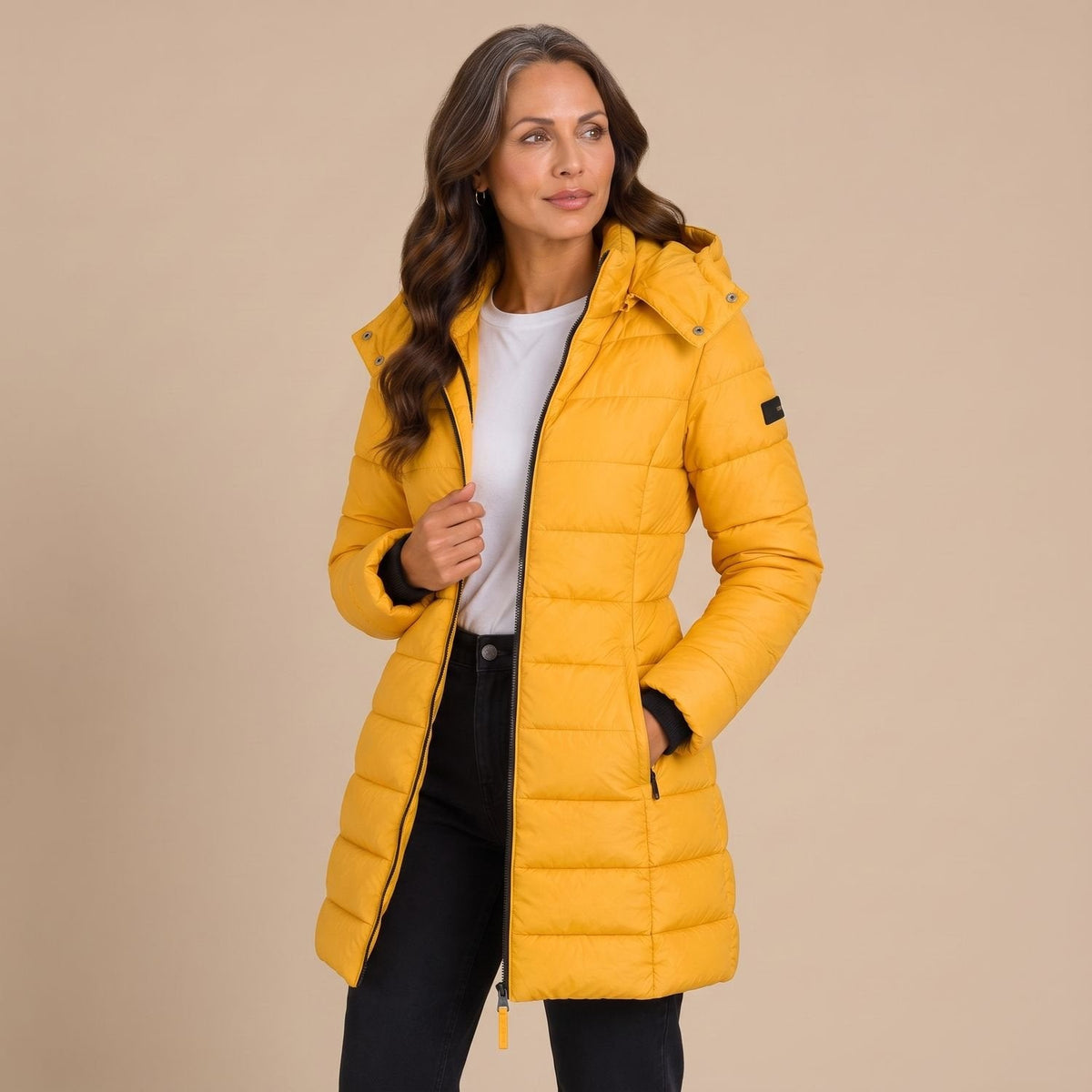 Women's quilted hooded longline puffer jacket with zip front and slanted pockets
