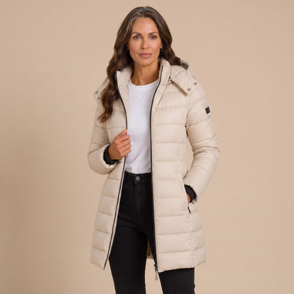 Women's quilted hooded longline puffer jacket with zip front and slanted pockets