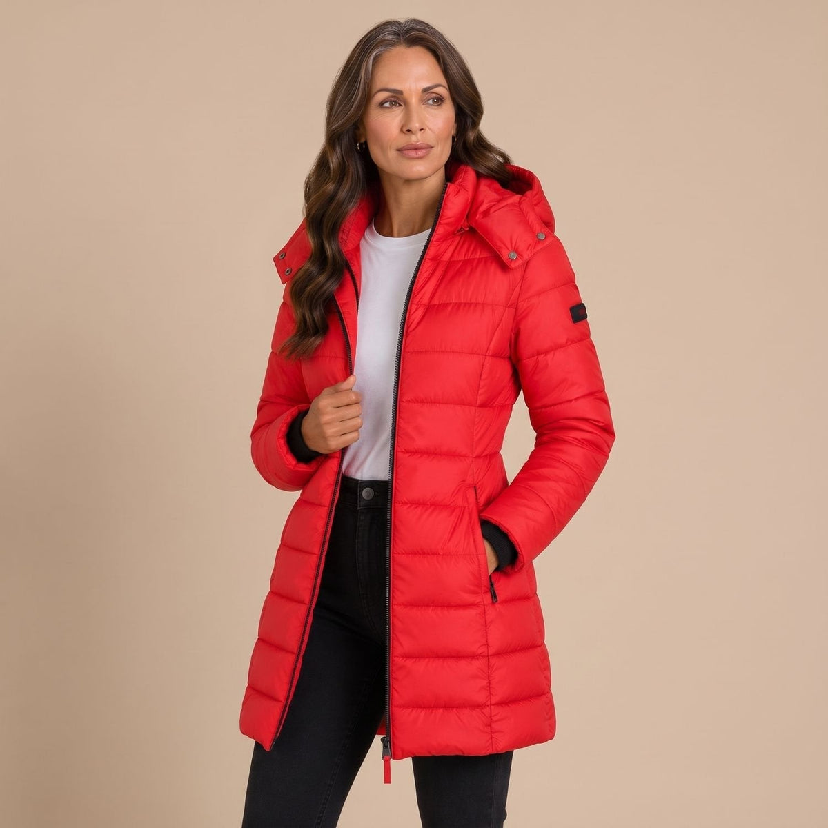 Women's quilted hooded longline puffer jacket with zip front and slanted pockets
