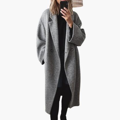 Women's longline collared coat with wide lapels, long sleeves and button details