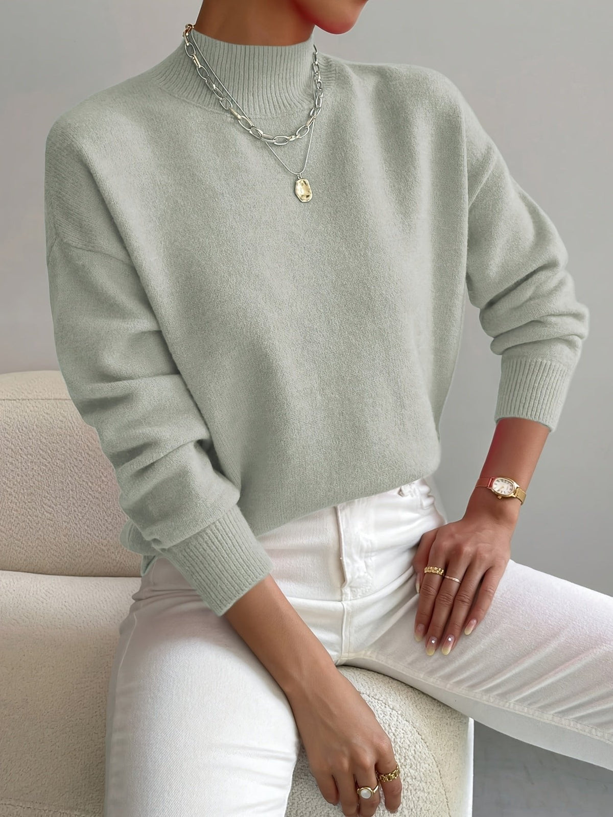 Women's relaxed mock turtleneck sweater with long sleeves and ribbed trims