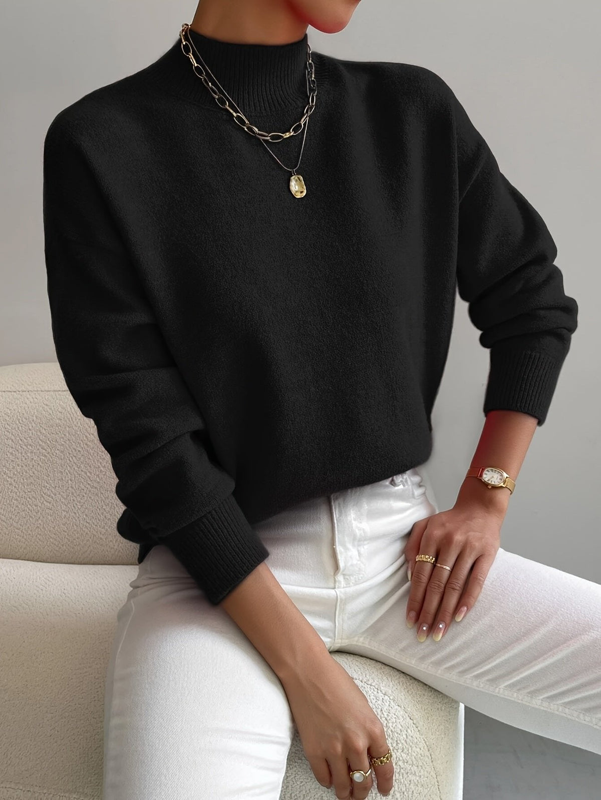 Women's relaxed mock turtleneck sweater with long sleeves and ribbed trims