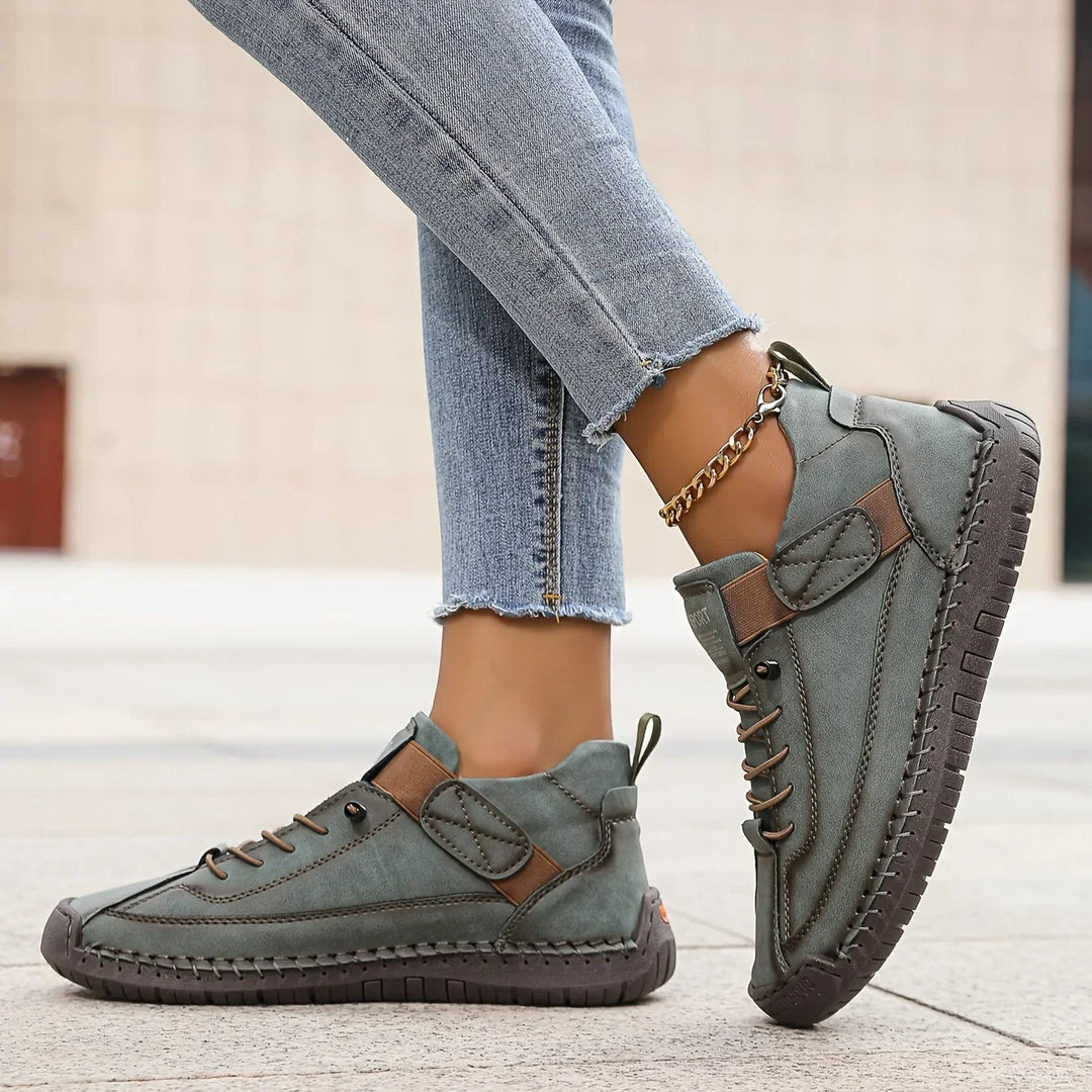 Women's casual lace-up sneaker with stitched panels and side strap