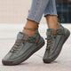 Women's casual lace-up sneaker with stitched panels and side strap