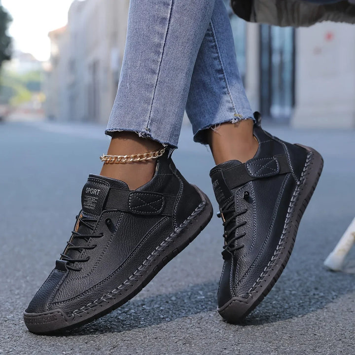 Women's casual lace-up sneaker with stitched panels and side strap