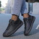 Women's casual lace-up sneaker with stitched panels and side strap