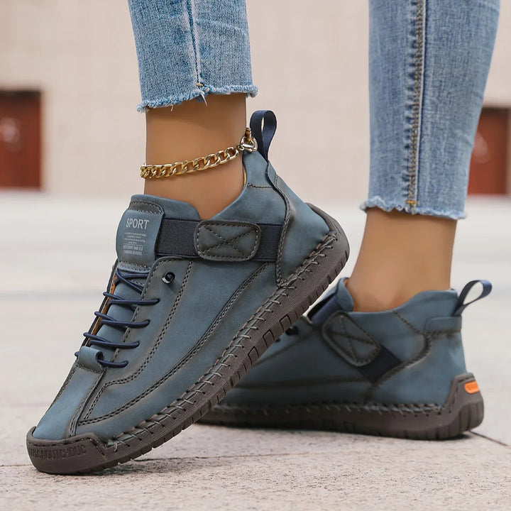 Women's casual lace-up sneaker with stitched panels and side strap