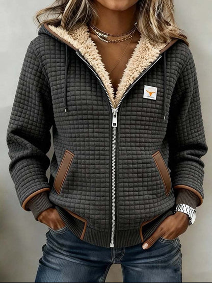 Women's gray quilted hooded jacket with sherpa-style lining and front zipper