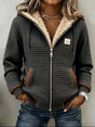 Women's gray quilted hooded jacket with sherpa-style lining and front zipper
